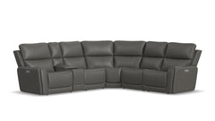 A large dark grey power reclining sectional sofa with multiple seats, including a chaise, upholstered in a faux leather fabric.