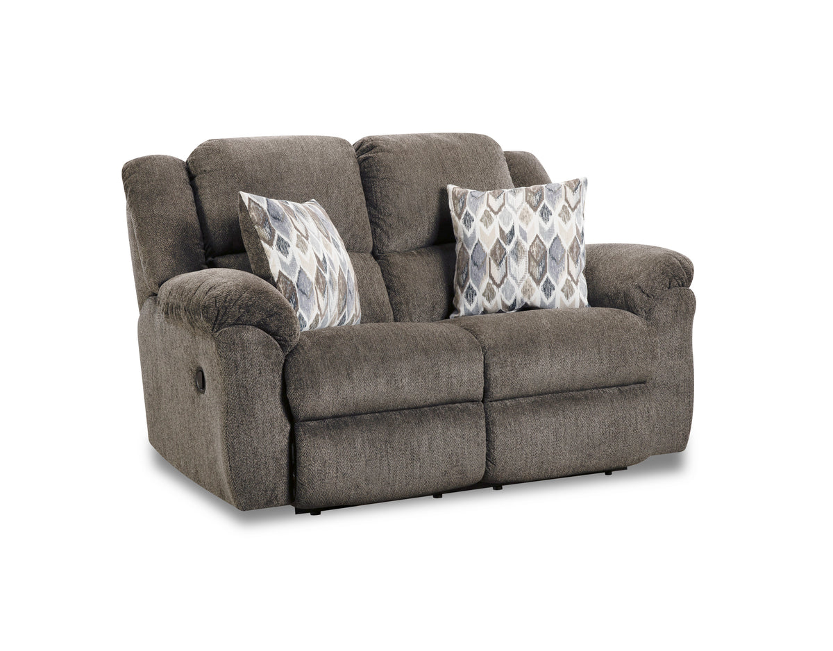 Gray sofa with patterned cushions on a white background