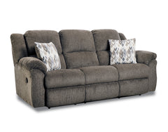 Gray sofa with patterned cushions on a white background