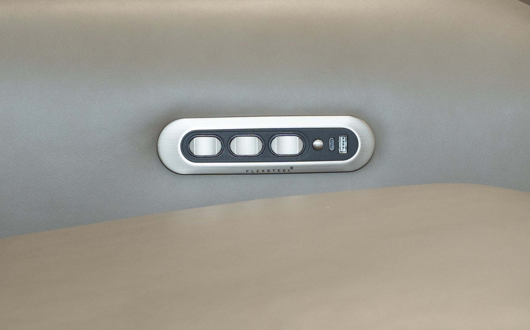 Control panel with multiple buttons on a vehicle's interior ceiling.