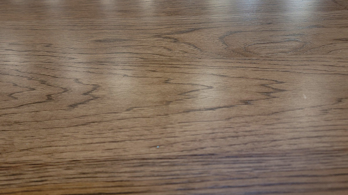 Close-up of a wooden surface with visible grain and texture