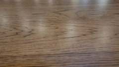 Close-up of a wooden surface with visible grain and texture