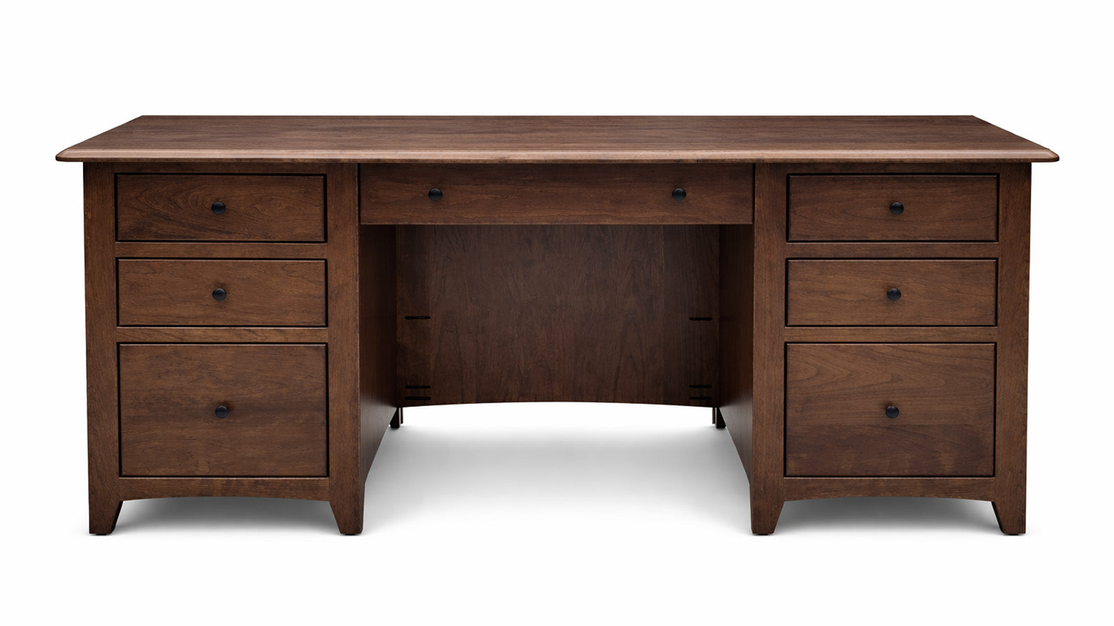 Wooden desk with multiple drawers on a white background