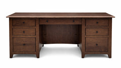 Wooden desk with multiple drawers on a white background