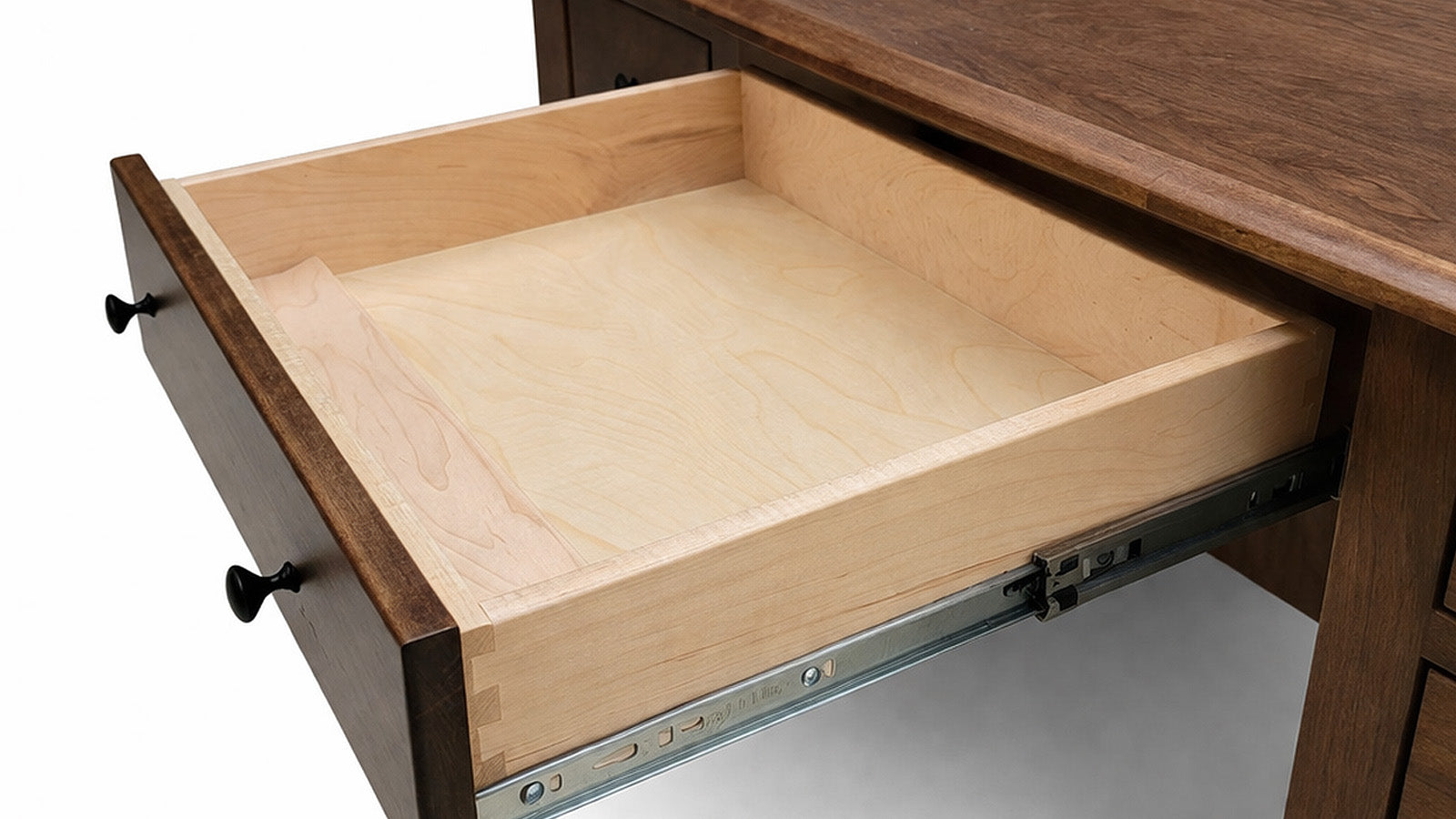 Wooden drawer being pulled out from a desk