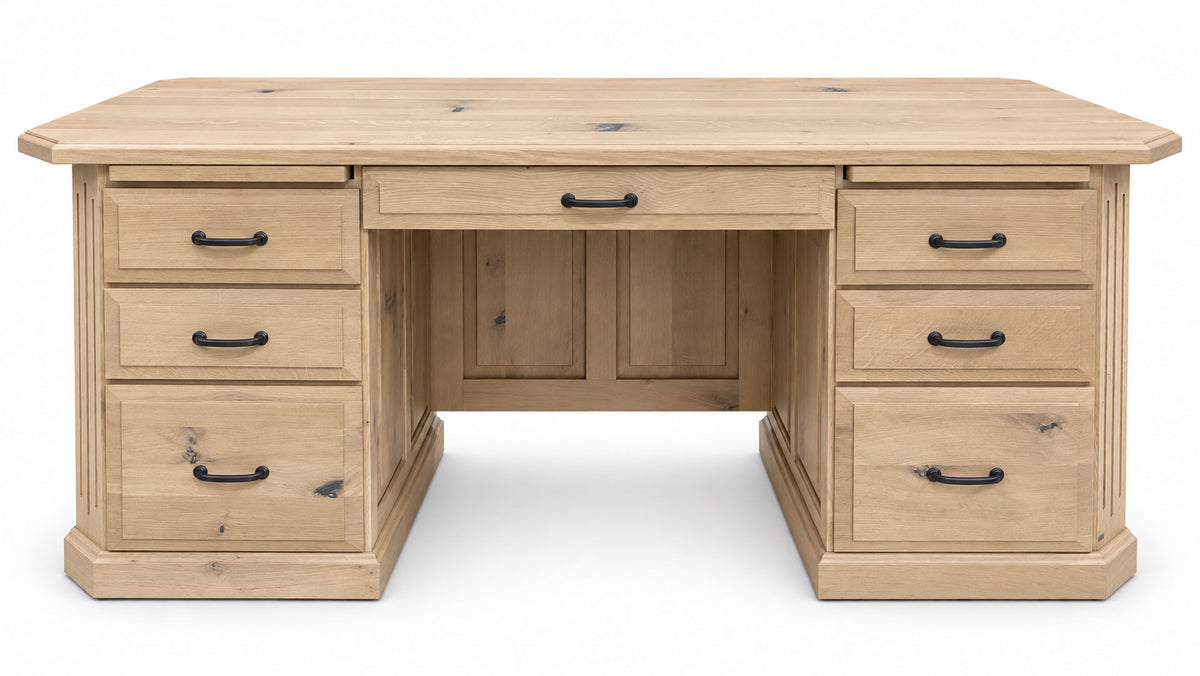 A light natural wood writing desk with a rectangular top, a central drawer, and four drawers on each side, featuring black metal handles.