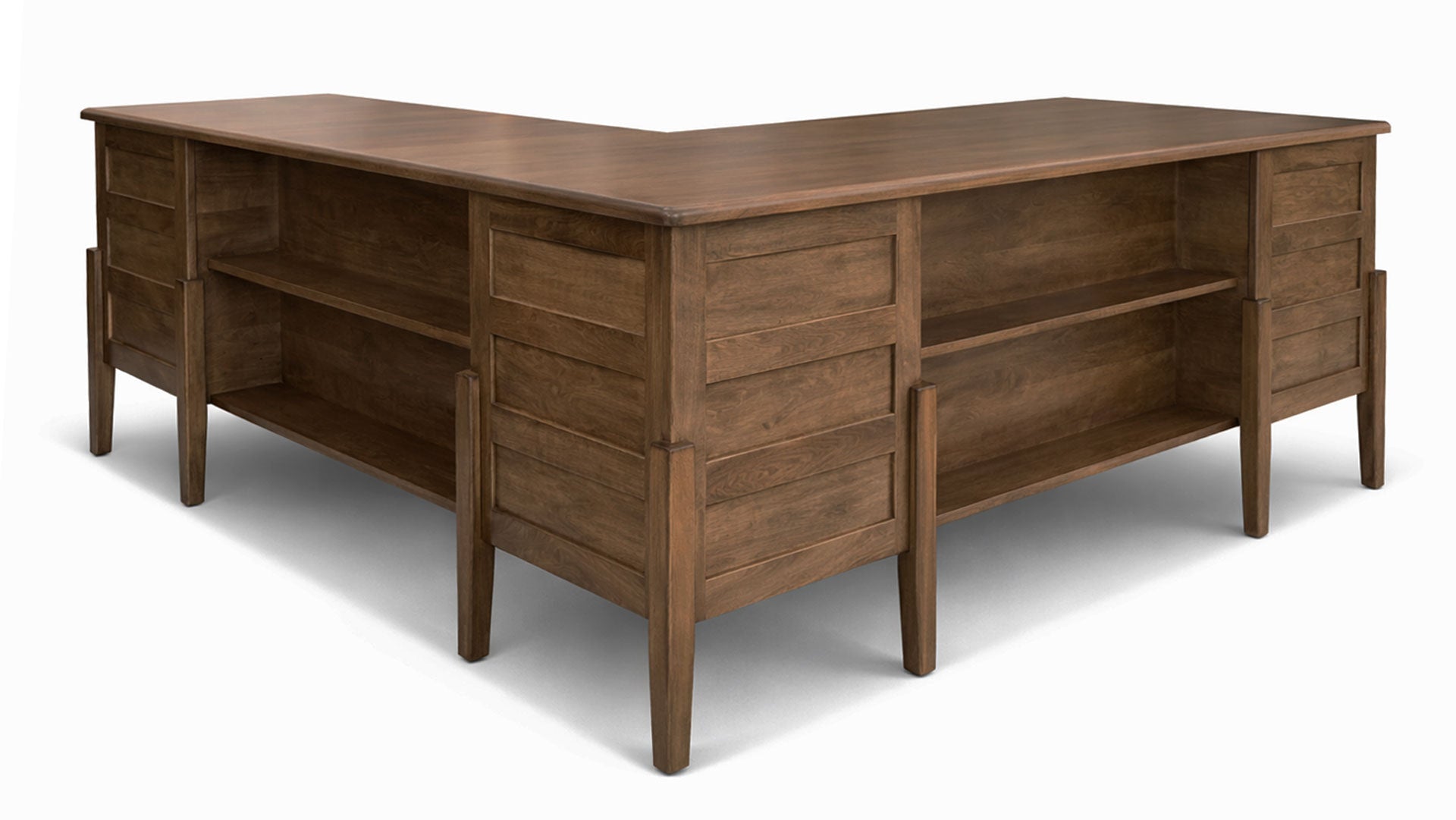 Wooden L-shaped desk on a white background