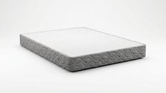A rectangular mattress shown at an angle on a dark gradient background, featuring a white top surface and a textured gray side with a geometric pattern.