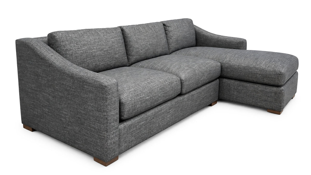 A gray textured fabric sectional sofa with a right-facing chaise lounge and low wooden feet, shown on a plain white background.