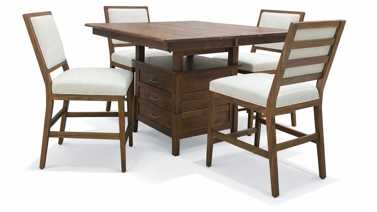 Wooden dining table with four matching chairs on a white background