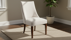 White chair with wooden legs in a room with a plant and rug