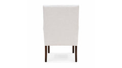 White upholstered chair with dark wooden legs on a white background