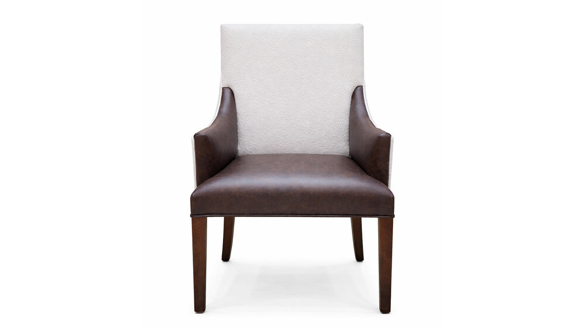 Chair with white cushioned backrest and brown leather seat and armrests on a white background