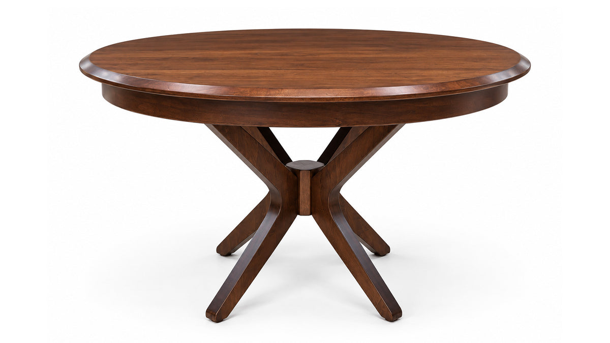 A round wooden dining table with a rich medium-brown finish, featuring a curved apron and a central pedestal base with four splayed legs, shown on a plain white background.