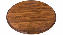 Round wooden table top with a warm medium-brown finish and visible wood grain, shown against a plain white background.