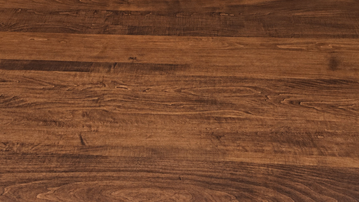 A close-up view of a dark brown wood grain surface with visible natural wood patterns and texture.