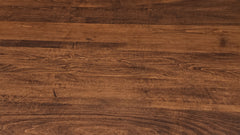 A close-up view of a dark brown wood grain surface with visible natural wood patterns and texture.