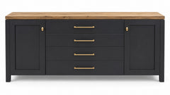 A modern sideboard or credenza with a matte black finish, a natural oak wood top, and brass hardware, shown against a plain white background.