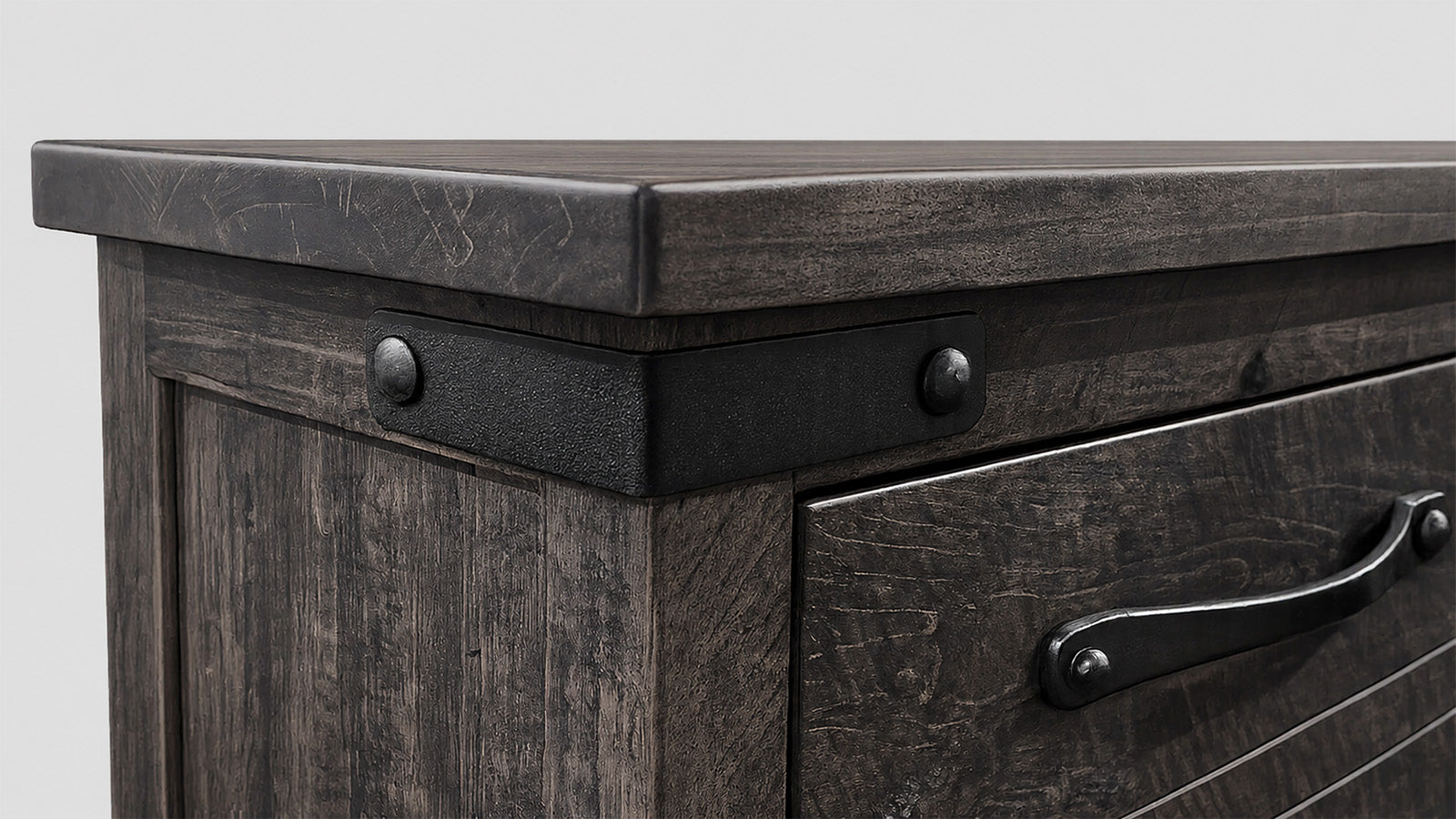Dark wooden dresser with metal handles on a white background