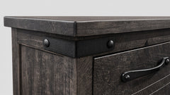 Dark wooden dresser with metal handles on a white background