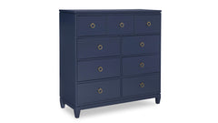 Navy blue dresser with gold knobs on a white background