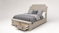 A light beige upholstered bed frame with a tall curved headboard and built-in storage drawers at the foot, shown with gray plaid bedding and patterned pillows on a neutral studio background.