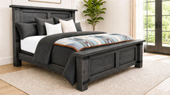 Wooden bed with bedding in a bedroom setting