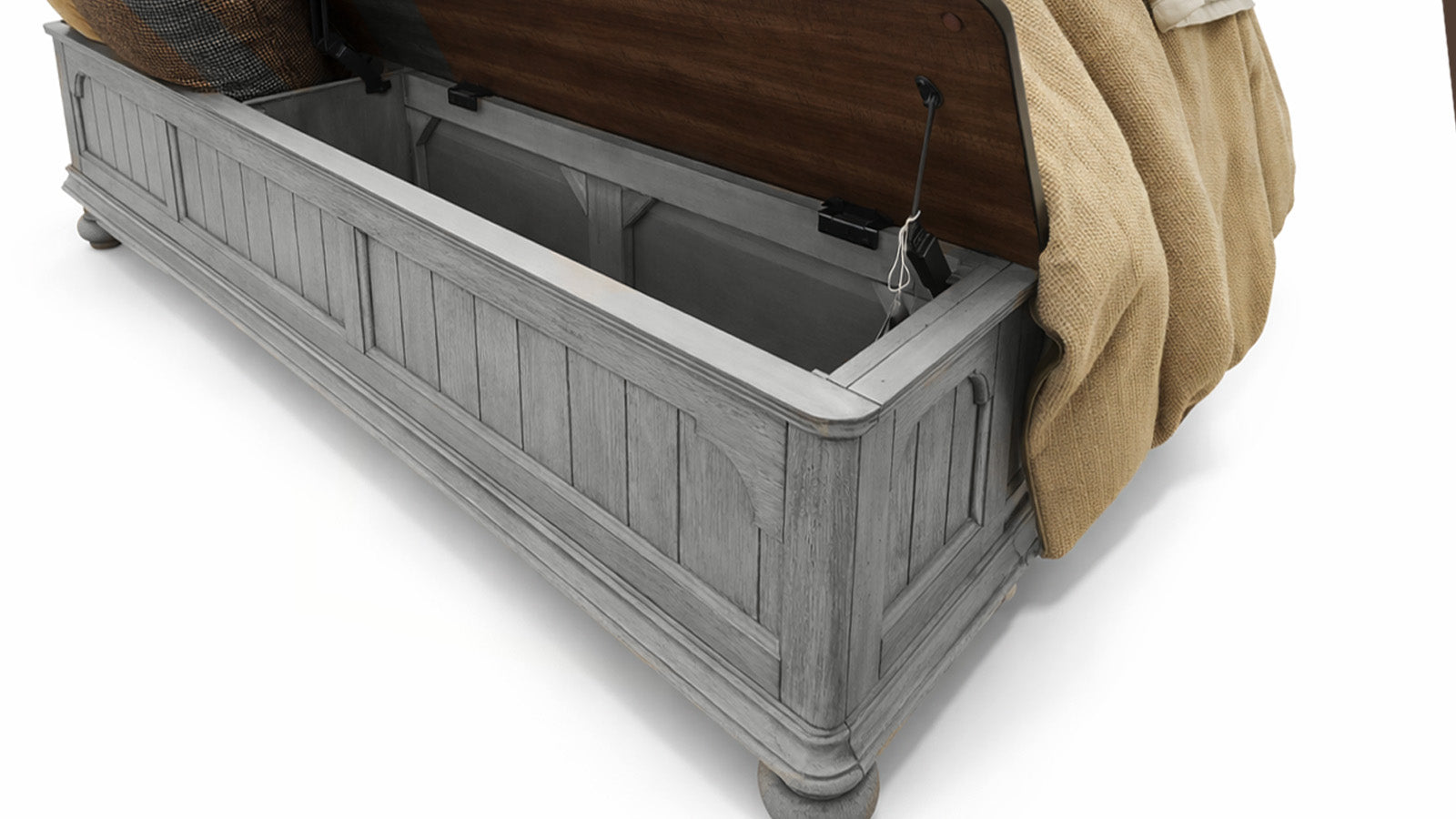Gray wooden bench with storage compartment and brown blanket on a white background