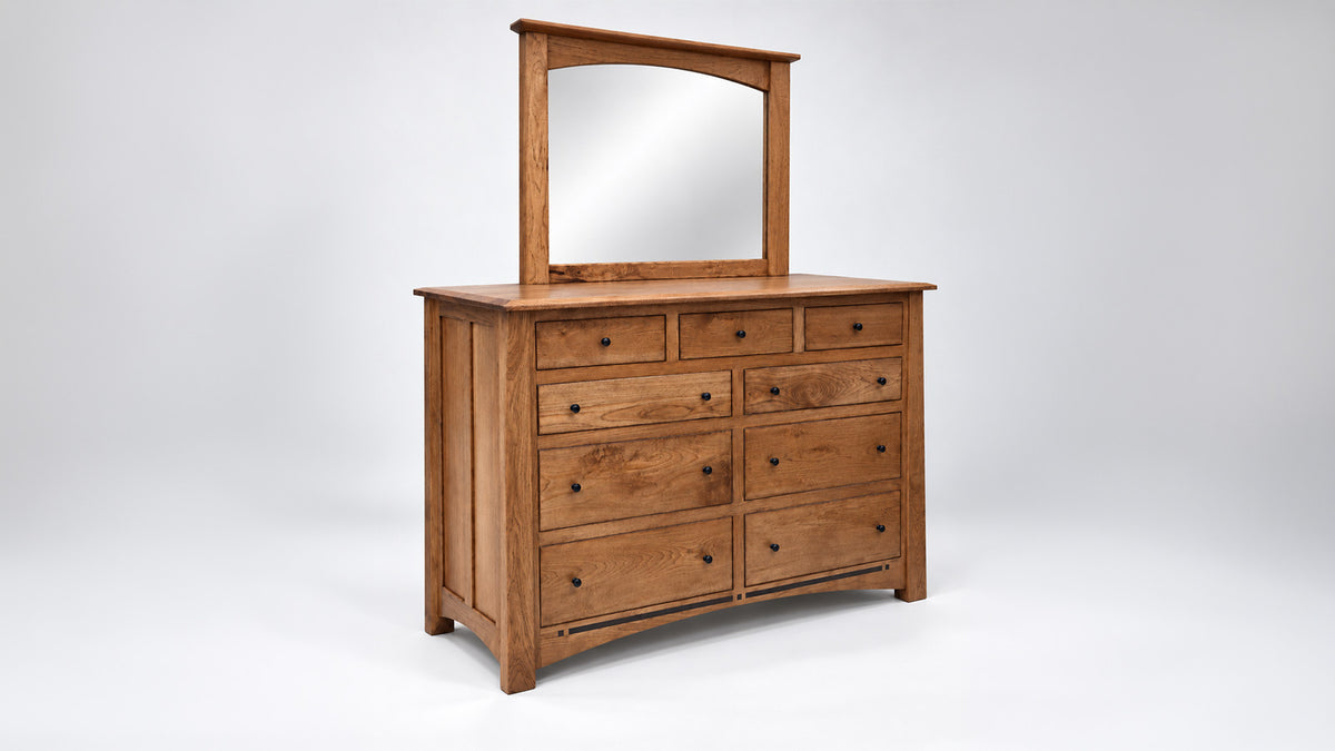 angle view of dresser and mirror on white
