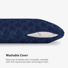 Navy blue quilted pillow cover with visible brand name on a light gray background