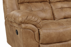 Brown leather reclining sofa on a white background