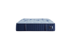 Blue mattress with a pattern on a white background