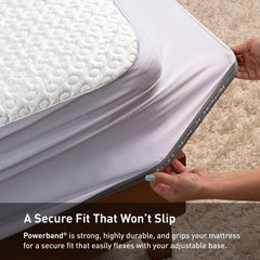 Person securing a mattress with Powerband, emphasizing a secure fit.