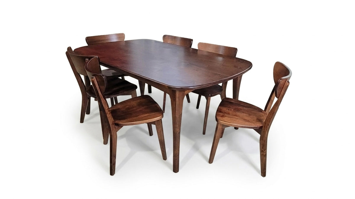 Wooden dining table with six chairs on a white background