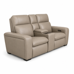 Beige leather recliner sofa with cup holders on a white background