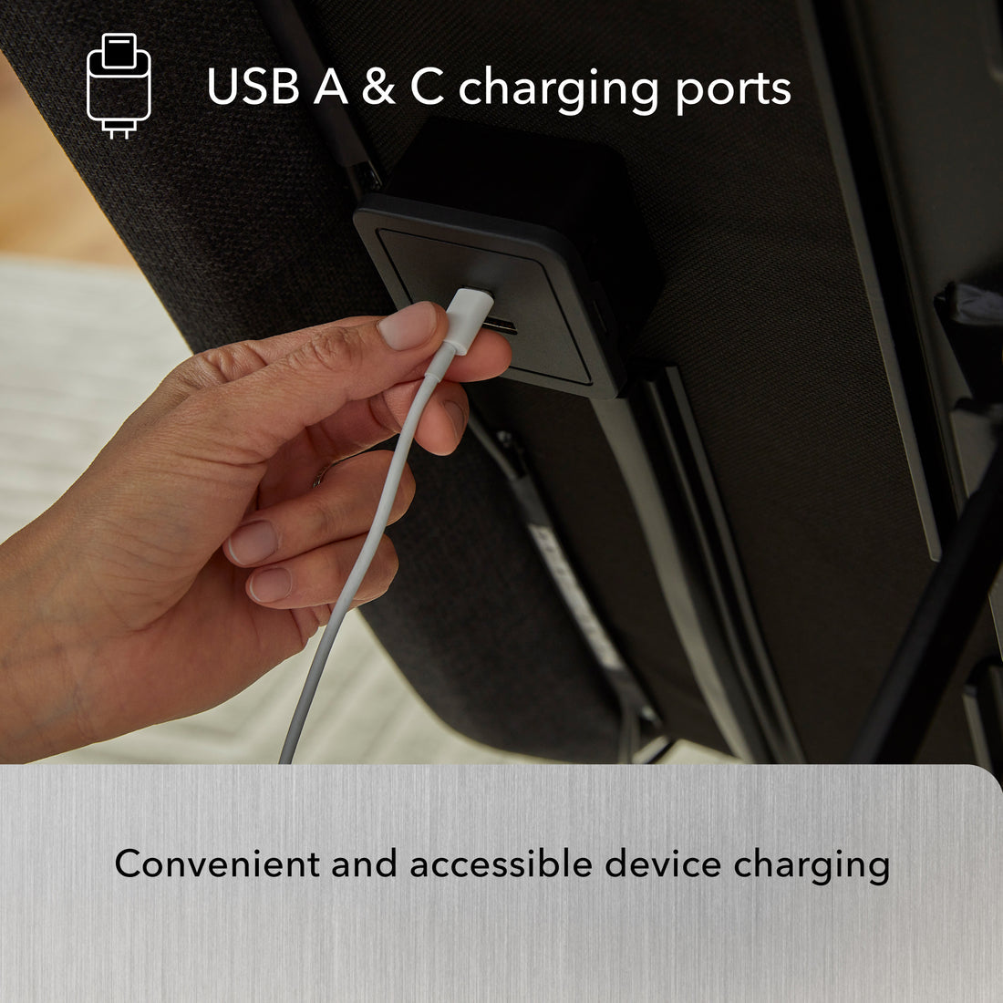Hand plugging a USB cable into a vehicle's USB A & C charging port.