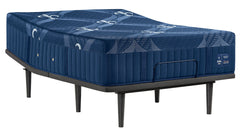 A navy blue mattress on a black metal bed frame, shown from a three-quarters angle against a solid white background.