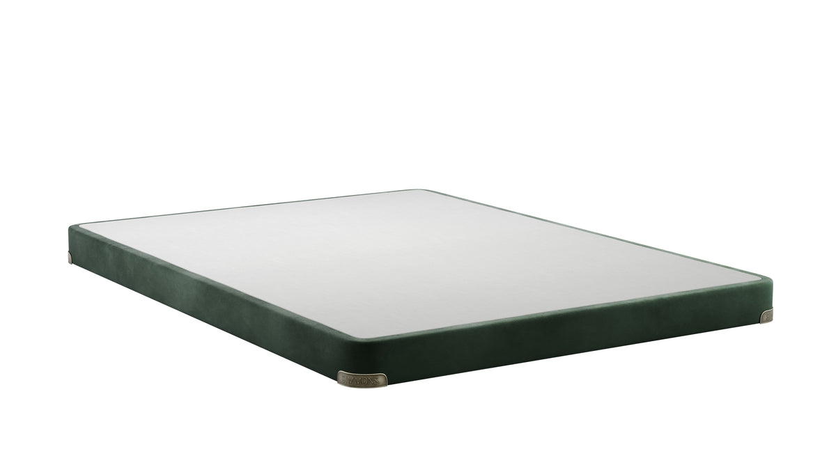 A rectangular floor lamp base or platform with a dark green velvet-covered frame and a clear glass top, shown at an angle on a white background.