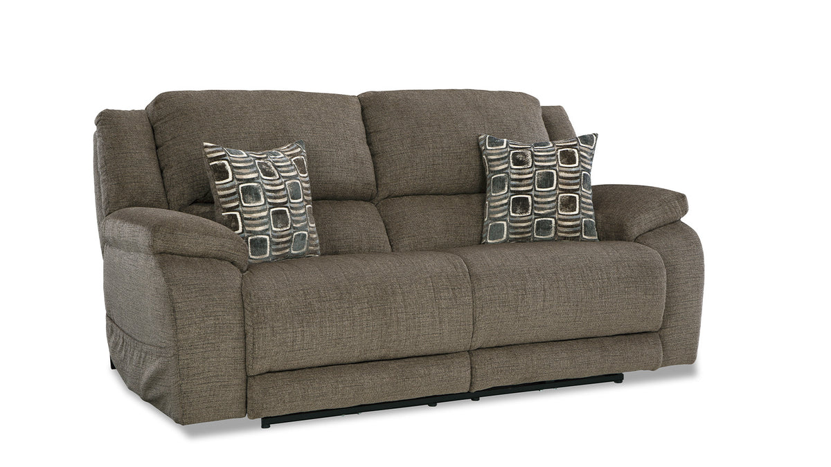 A brown power reclining sofa with two seat cushions, featuring power controls, solid foam arm pads, and decorative pillows.