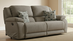 Gray sofa with patterned cushions in a room with a window.