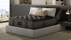 Gray adjustable bed with pillows in a modern bedroom setting
