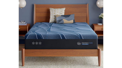 Blue mattress on a wooden bed frame with 'Innosleep' branding in a bedroom setting.
