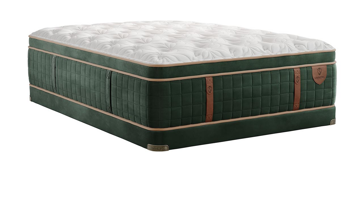 Green mattress with quilted design on a white background