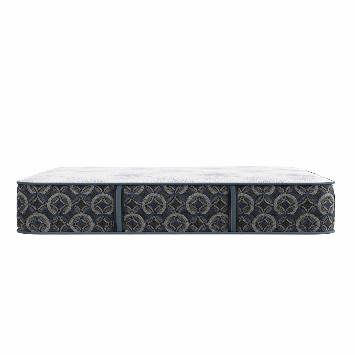 Un colchón visto de perfil sobre un fondo blanco liso, con una funda de tela con motivos geométricos en azul marino oscuro y gris, y la superficie superior blanca.