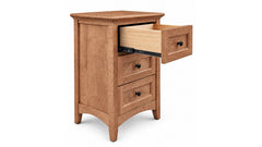 A three-drawer wooden nightstand or end table with a medium brown finish and one open drawer showing light wood interior, photographed on a clean white background.