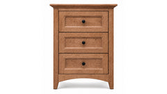 A three-drawer wooden nightstand or dresser in a warm medium brown finish, featuring three drawers with inset panel fronts and small round black knobs, shown against a plain white background.