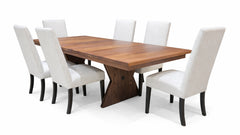 Wooden dining table with six white chairs on a white background