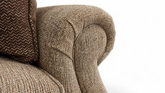 Close-up of a textured brown armchair on a white background