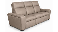 Beige leather sofa with power reclining feature on a white background