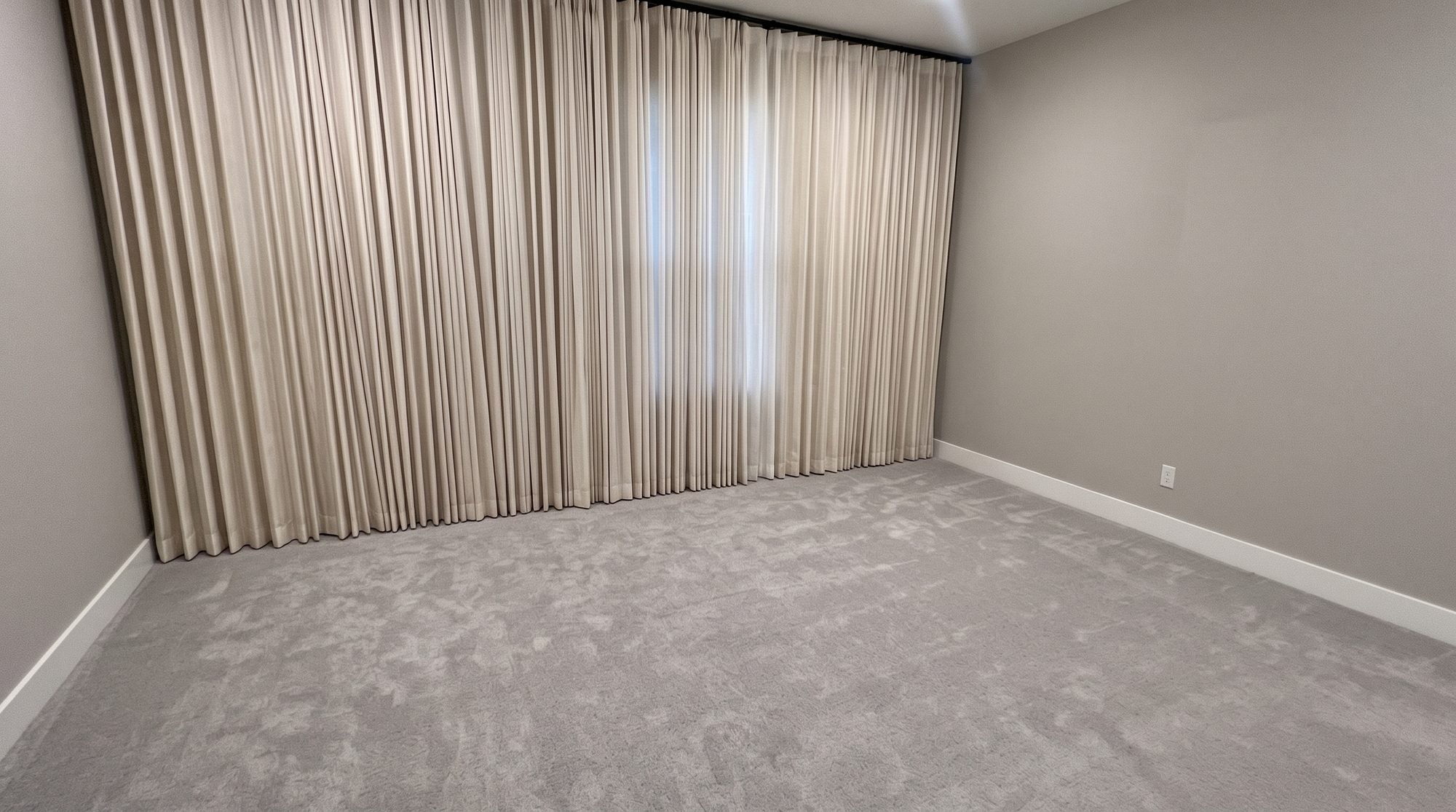 Tired dated primary bedroom before renovation with sagging mattress and dated floral bedding